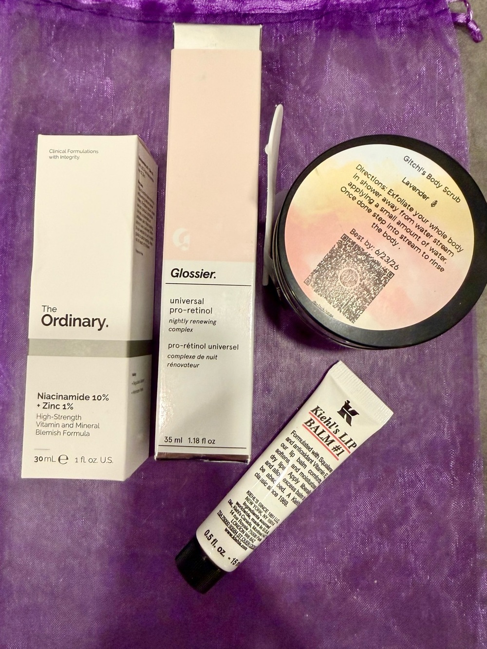 Pamper Your Skin Set: Ordinary serum, Glossier retinol, Kiehl's lip balm, Scrub.